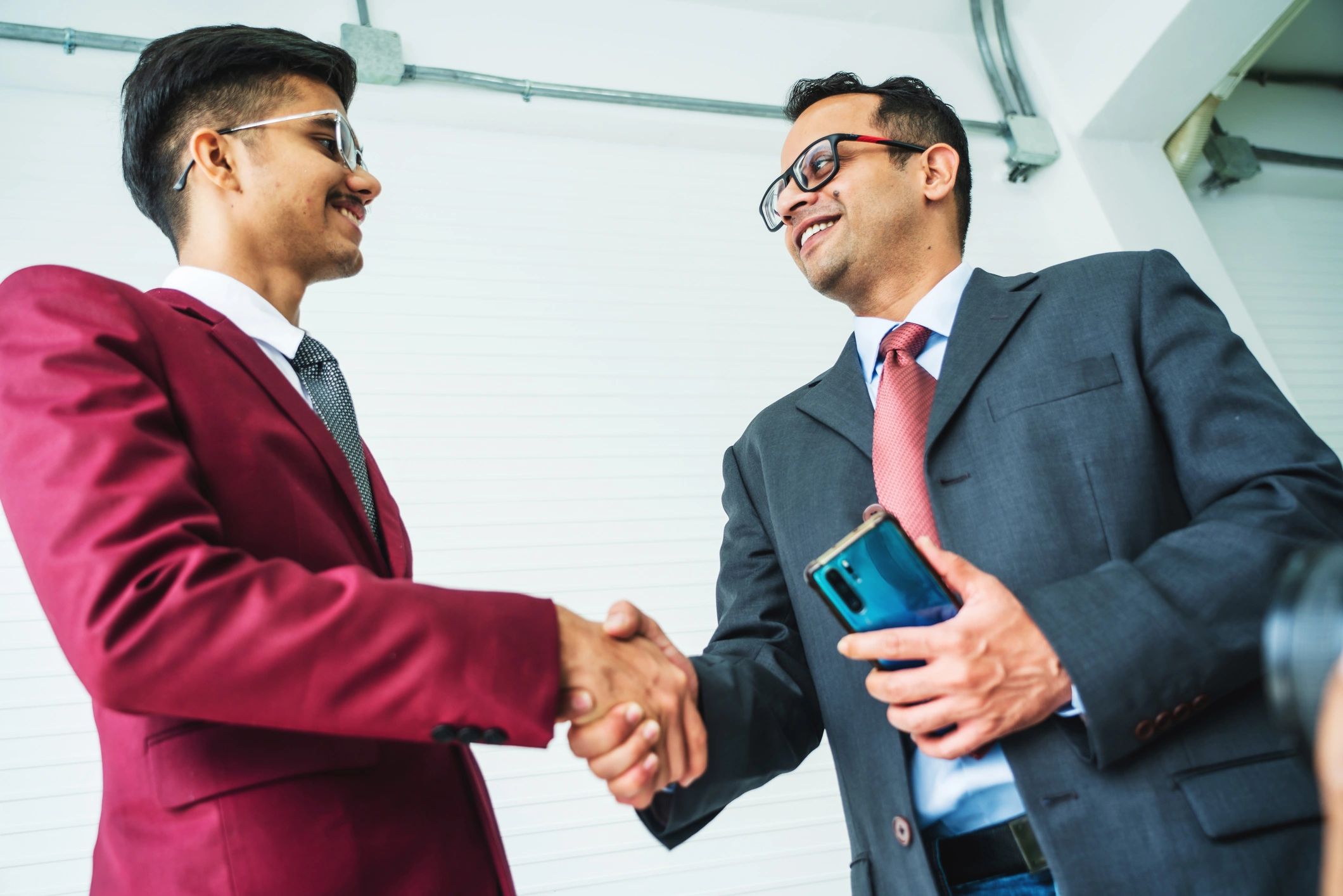 Business professionals shaking hands after an agreement